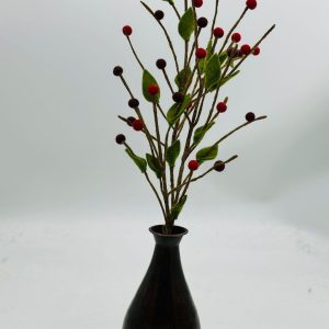 Handmade felt flower with layered petals.