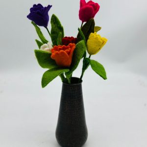 Handmade felt flower with layered petals.