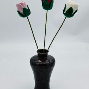 Handmade felt flower with layered petals.