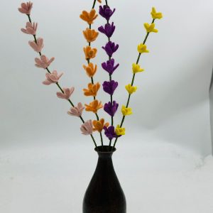 Handmade felt flower with layered petals.