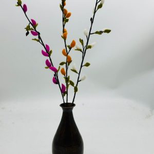 Handmade felt flower with layered petals.