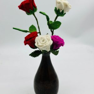 Handmade felt flower with layered petals.