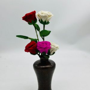 Handmade felt flower with layered petals.