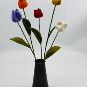 Handmade felt flower with layered petals.