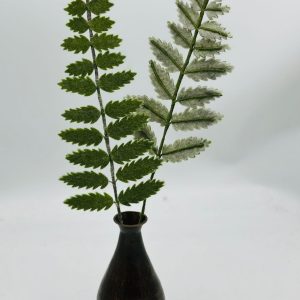 Handmade felt flower with layered petals.