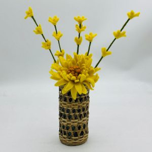 Handmade felt flower with layered petals.