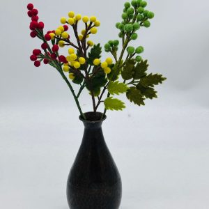 Handmade felt flower with layered petals.