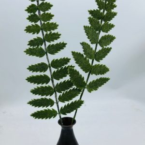 Handmade felt flower with layered petals.