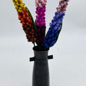 Handmade felt flower with layered petals.