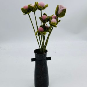 Handmade felt flower with layered petals.