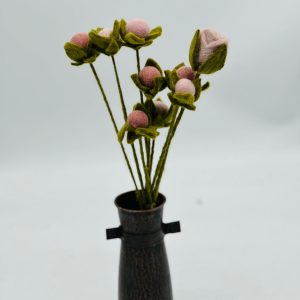 Handmade felt flower with layered petals.