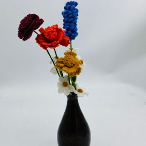 Handmade felt flower with layered petals.