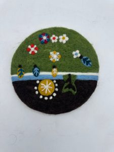 Handcrafted felt decor piece for kitchens and home spaces.