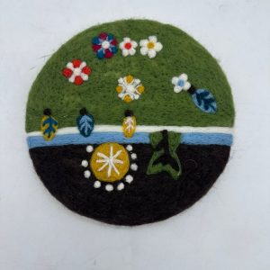 Handcrafted felt decor piece for kitchens and home spaces.