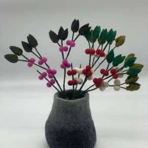 Handmade felt flower with layered petals.