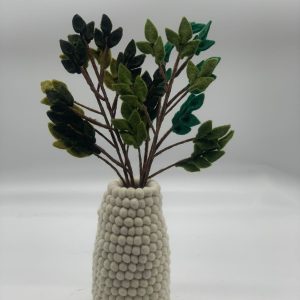 Handmade felt flower with layered petals.