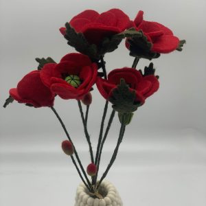 Handmade felt flower with layered petals.